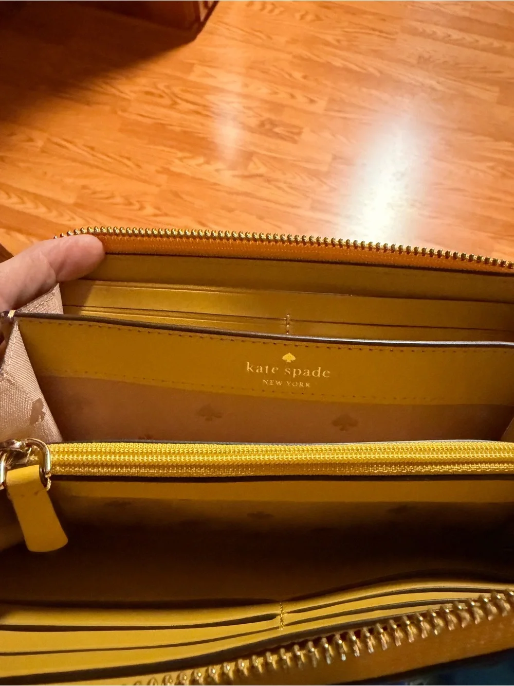 kate spade pebbled yellow zip-around wallet